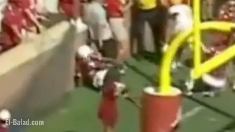 Football Player Injured in Collision with Brick Wall During Game