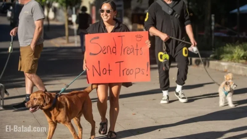 Protesters with Dogs and Dance Greet Kristi Noem in Portland