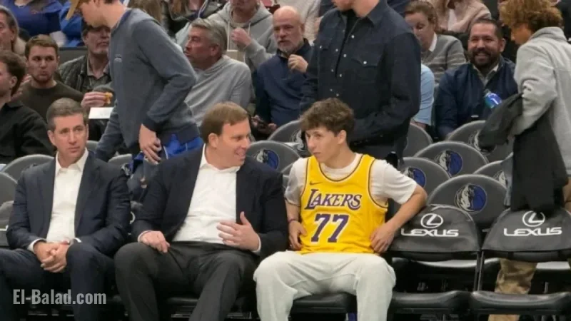 Mavericks Fan in Doncic Lakers Jersey Chats Courtside with Patrick Dumont