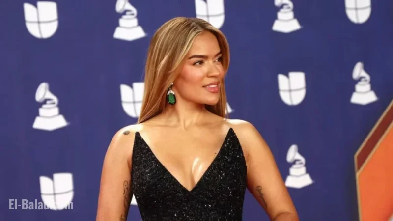 Karol G Stuns in Black Feathered Gown and Emerald Jewels at Latin Grammys