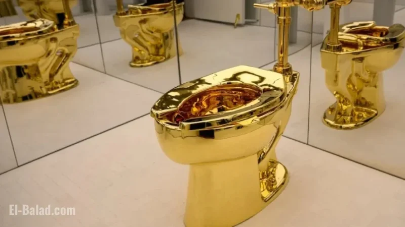 Maurizio Cattelan’s Gold Toilet Fetches $12 Million at Auction