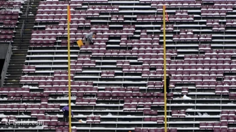 UM Clears Washington-Grizzly Stadium Snow for Playoff Game Preparation