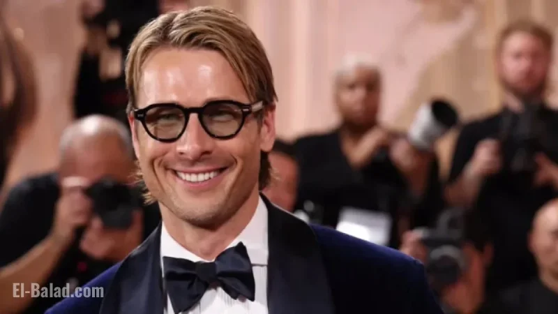 Glen Powell Stuns in Midnight Blue Tux at Golden Globes Arrival