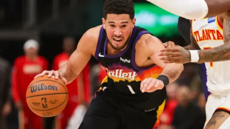 Devin Booker Exits Game with Right Ankle Injury as Teammate Falls