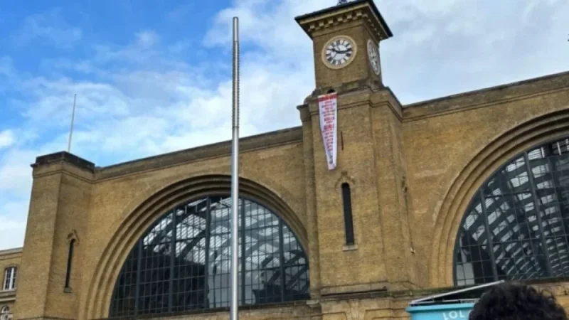 Protester Climbs King’s Cross Station as Firefighters Respond