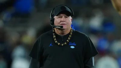 Chip Kelly’s purple vest and hard hat at Northwestern capture a bigger story