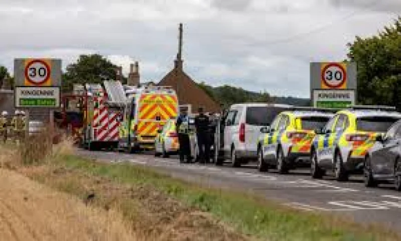 Around ten police vehicles close Drumsturdy Road into Kingennie