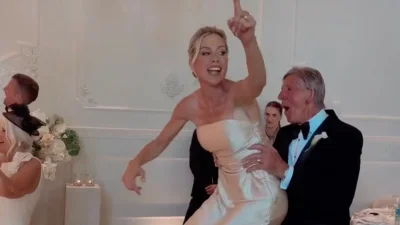 Kate Lawler falls off chair at Portugal wedding reception