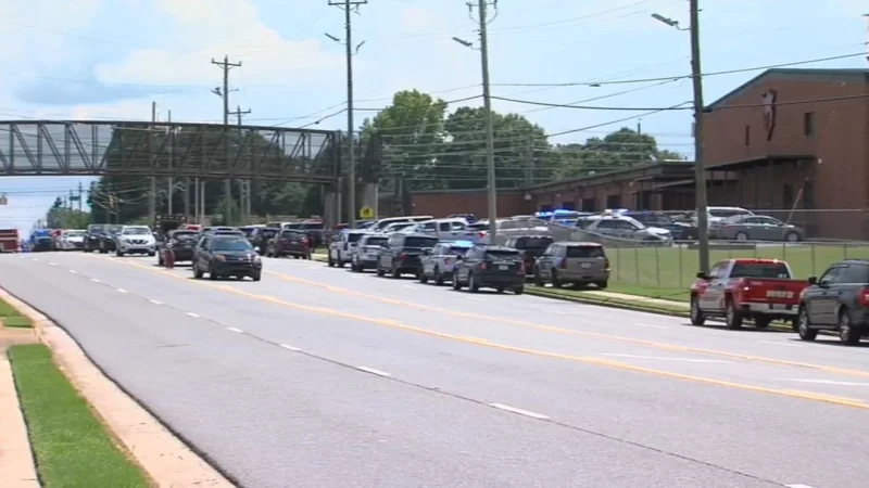 Houston County Sheriff's Office responds at Warner Robins High School after shooting reports