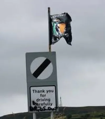 Colum Eastwood demands removal of Creggan flag calling for killings