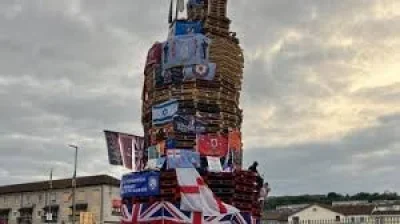 Colum Eastwood condemns Sinn Féin flag over Derry death call