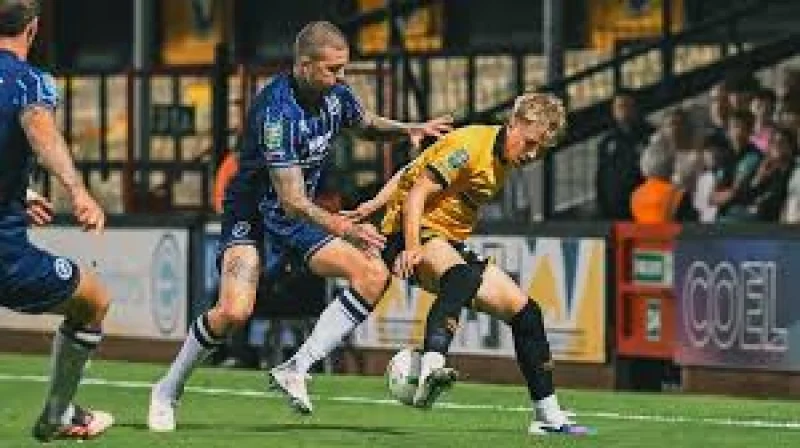 Jake Cooper's ninth-minute winner sends Millwall Fc through as The Abbey turns into a narrow, ugly job well done