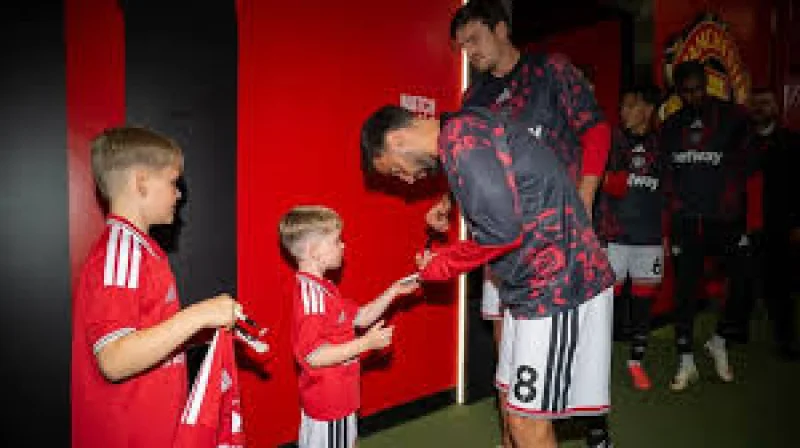 Manchester United Tribute Pc Matthew Blades: sons lead out Old Trafford as club pays tribute