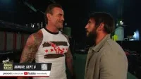 Johnny Gargano gets to his feet after CM Punk's title offer
