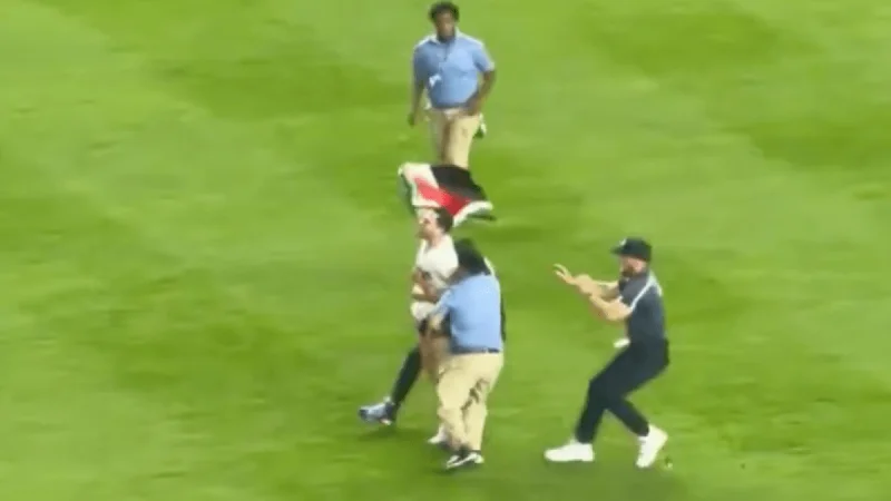9:11 p.m. on 9/11 anniversary: Fan Runs Onto Yankee Stadium Field and turns a tense night into a mess