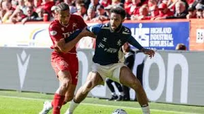 Don Robertson waves play on after Greg Kiltie is barged down in Kilmarnock Vs Aberdeen