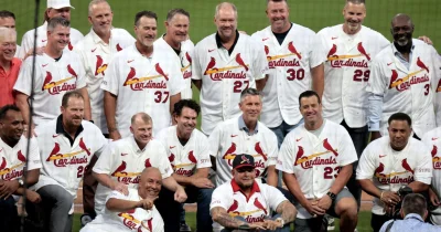 Yadier Molina waves at 2006 Cardinals reunion at Busch Stadium — a reminder of how championship history still sells the place