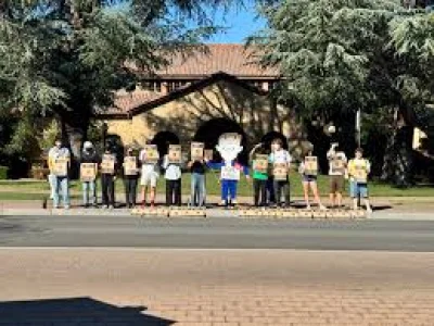Arin Iverson leads Stanford Defcon protest outside Encina Commons