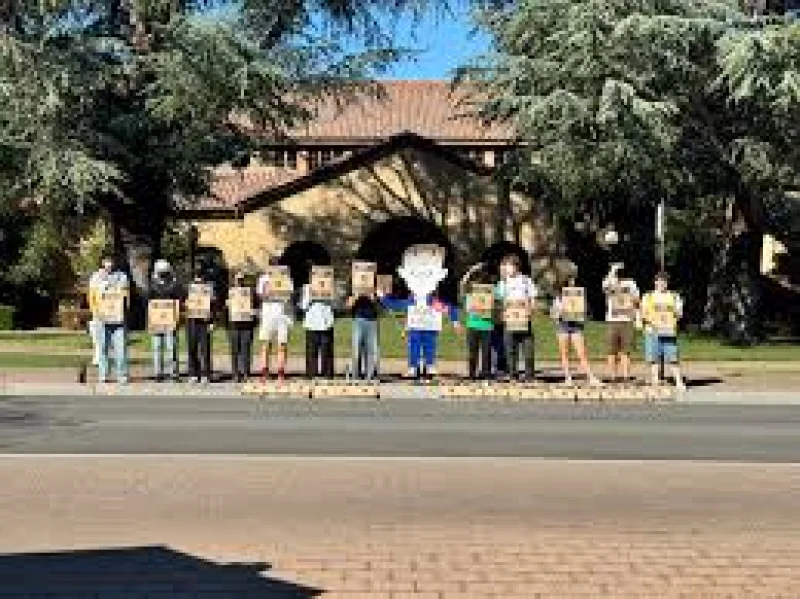 Arin Iverson leads Stanford Defcon protest outside Encina Commons