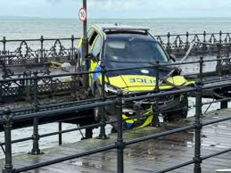 Hampshire & Isle of Wight Constabulary car wedges over Ryde Pier