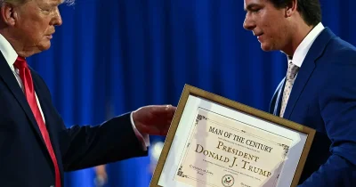 Joe Mitchell gives Trump Man of the Century Award in Sioux City