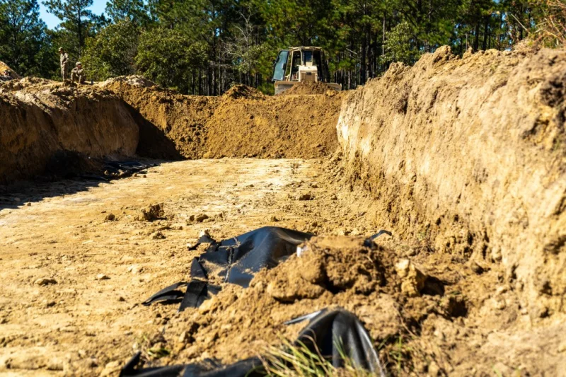 U.S. Army tests Mass Graves with five trenches for 100 bodies