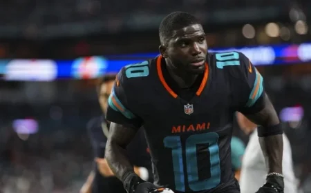 Tyreek Hill Rejoins Dolphins, Addresses Team at Facility