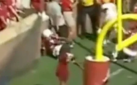 Football Player Injured in Collision with Brick Wall During Game