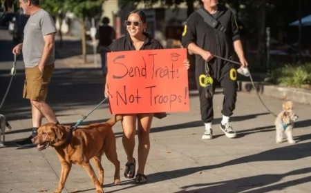 Protesters with Dogs and Dance Greet Kristi Noem in Portland