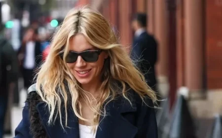 Sienna Miller Elevates High Street Fashion with Chic Coat and Jeans Ensemble