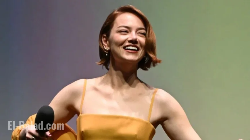 Emma Stone Dazzles in Taylor Swift-Inspired Orange Louis Vuitton Gown