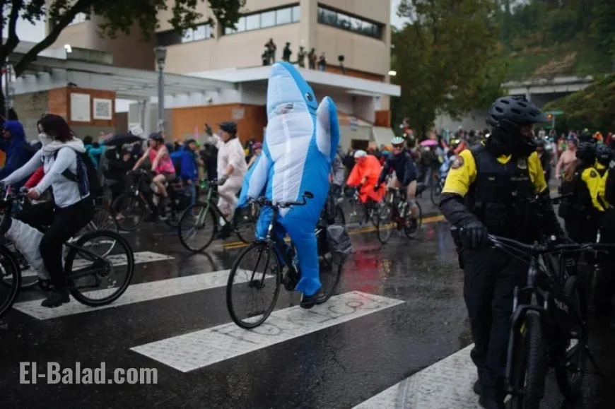 Cyclists Brave Portland’s Wet Weather in ICE Protest Parade