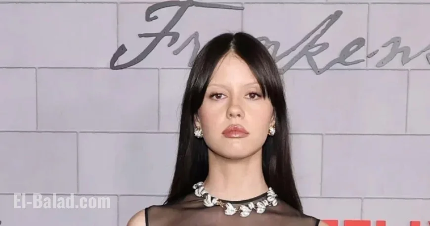 Mia Goth Masters Macabre Glamour in Sheer Little Black Dress