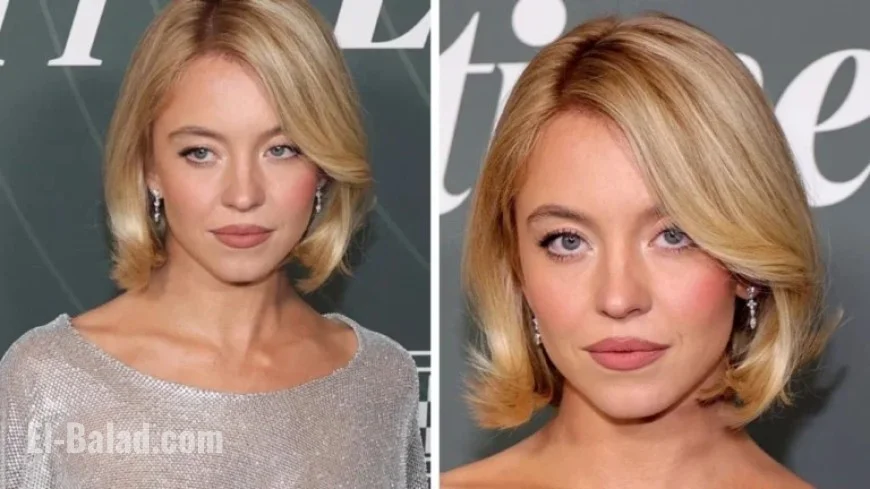 Sydney Dazzles in Bold Red Carpet Gown