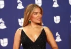 Karol G Stuns in Black Feathered Gown and Emerald Jewels at Latin Grammys