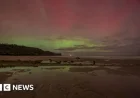 Timelapse Captures Stunning Northern Lights Display Over Coastline