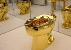 Maurizio Cattelan’s Gold Toilet Fetches $12 Million at Auction