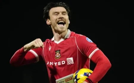 Wrexham Celebrates Moore’s Hat Trick in Statement Victory