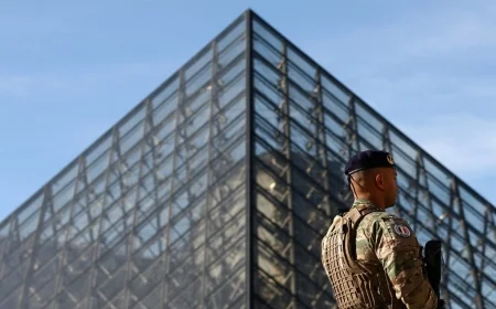 Louvre heist suspects: woman charged as probe widens; ministers promise rapid security overhaul after $100m jewel raid