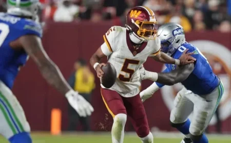 Commanders’ QB Daniels Exits Game with Apparent Elbow Injury