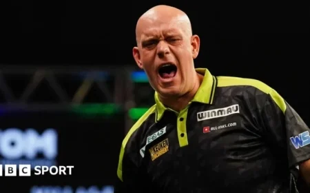 Michael van Gerwen Survives Greaves Scare; Littler Triumphs at Grand Slam of Darts