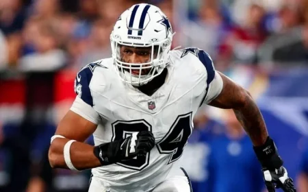 Cowboys Honor Kneeland with Special Decals and Shirts