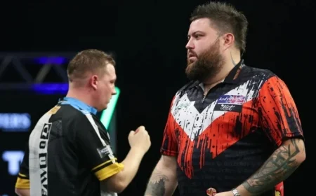 Michael Smith Faces Luke Humphries in 2025 Grand Slam After Chris Dobey Thriller