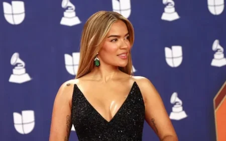 Karol G Stuns in Black Feathered Gown and Emerald Jewels at Latin Grammys