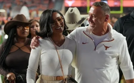 Loreal Sarkisian Impresses in Burnt Orange Boots at Texas-Georgia Game
