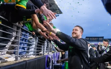 Oregon Secures College Football Playoff Spot with 26-14 Win Over Washington