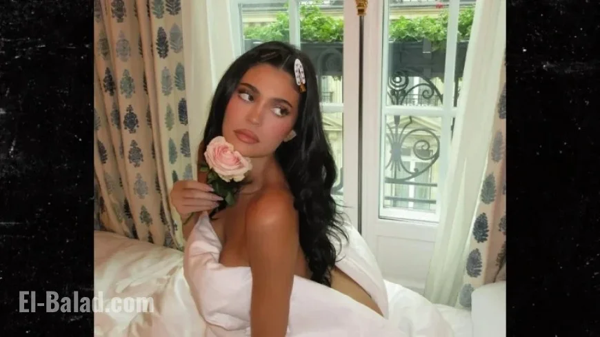 Kylie Jenner Poses with Sheet in Alluring Instagram Photo