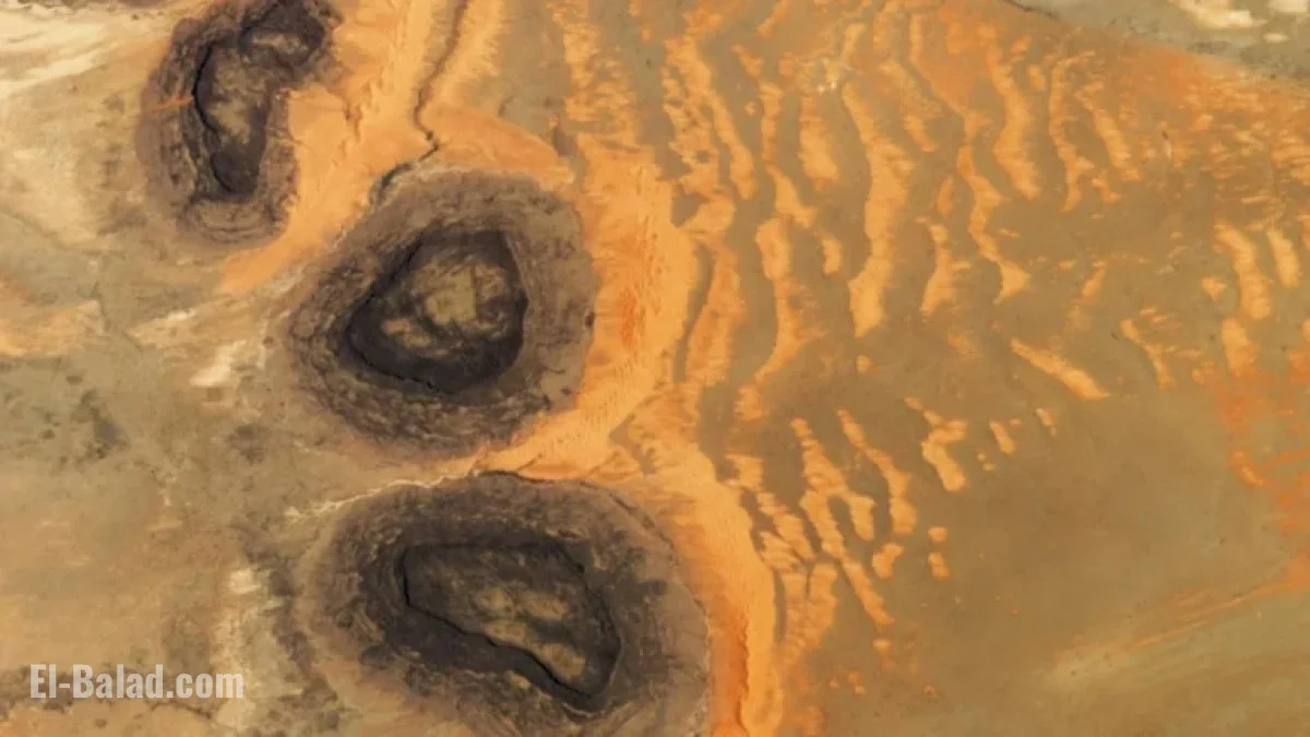 Image for Rare Sahara Sand Dunes Emerge from Paleozoic ‘Black Mesas’ Seen from Space