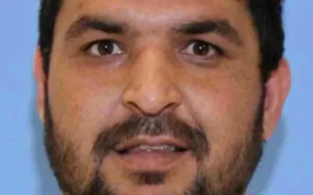 Hospitalized Accused National Guard Shooter Pleads Not Guilty to Murder and Assault