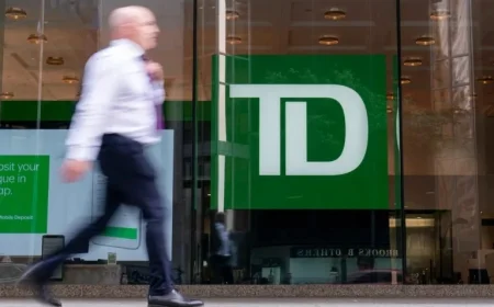 TD Reports Profit Decline Amid Restructuring, Increases Dividend